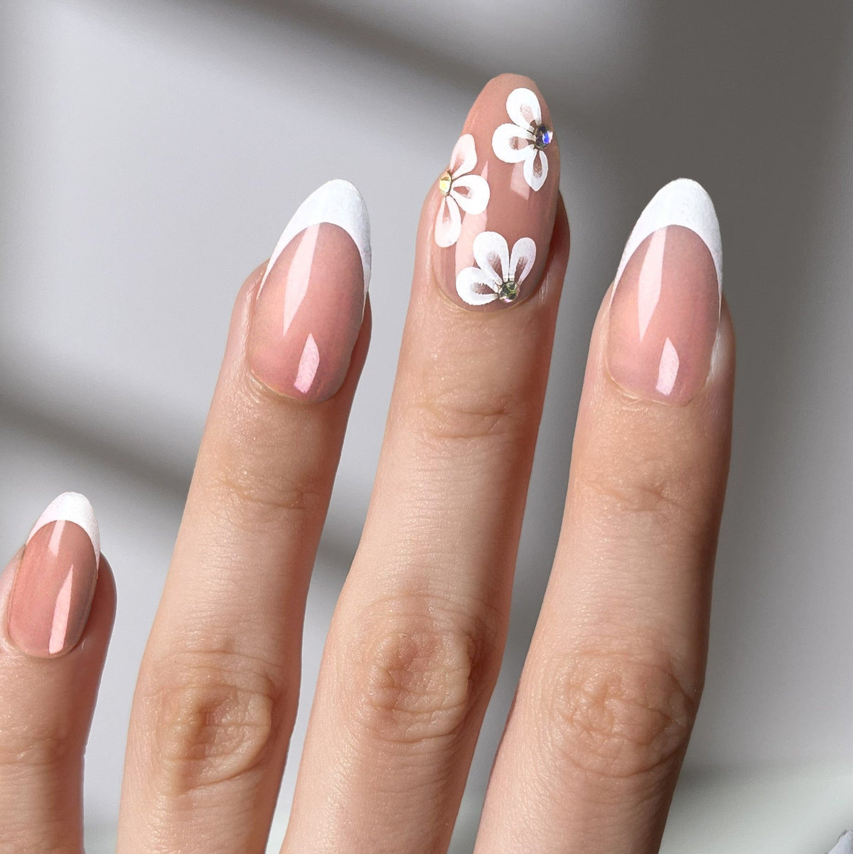 Peach Fleur - Almond Sustainable Nails — tight close-up of the nail design